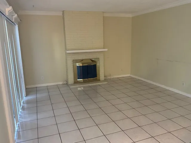 a view of an empty room and window