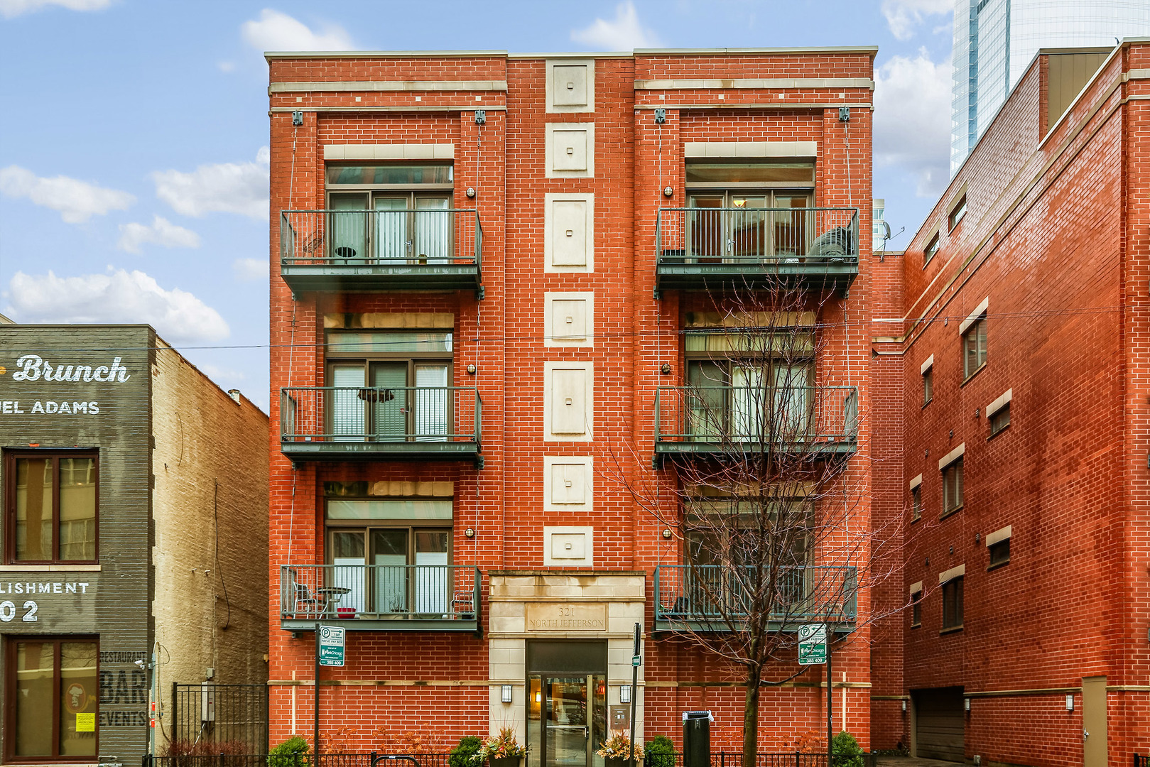 a front view of a multi story residential apartment building