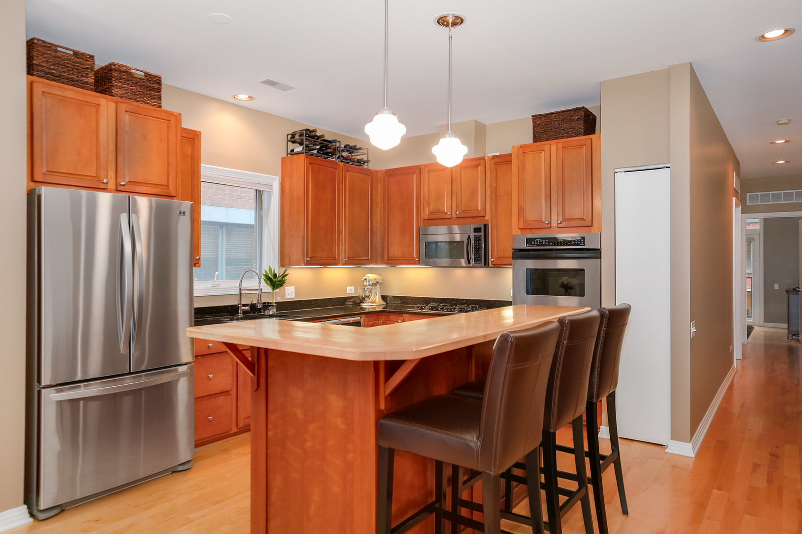 321 North Jefferson Street, Unit 401 Chicago, IL 60661 - Photo 6 of 33 a kitchen with stainless steel appliances a stove a refrigerator and a refrigerator