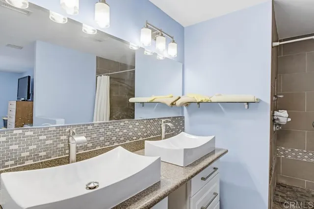 a bathroom with a sink and a mirror