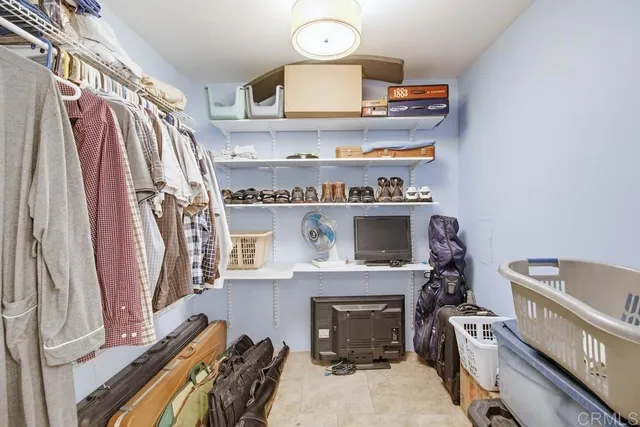 a room with a fireplace and a mirror