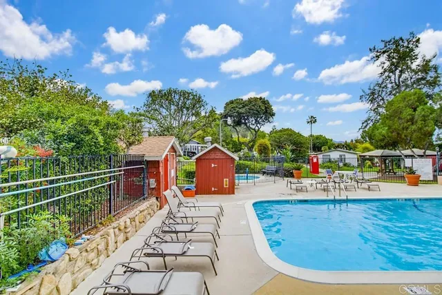 a view of swimming pool with seating space