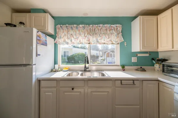 a kitchen with a sink and a window
