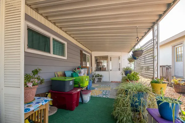 a front view of a house with outdoor seating