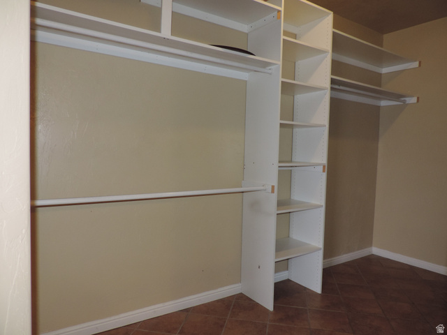 140 North 200 E Street Glenwood, UT 84730 - Photo 22 of 54 Walk in closet featuring dark tile patterned flooring