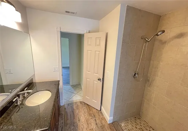 a bathroom with a sink and a mirror