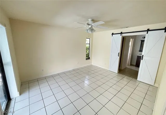 a bathroom with a toilet and a mirror