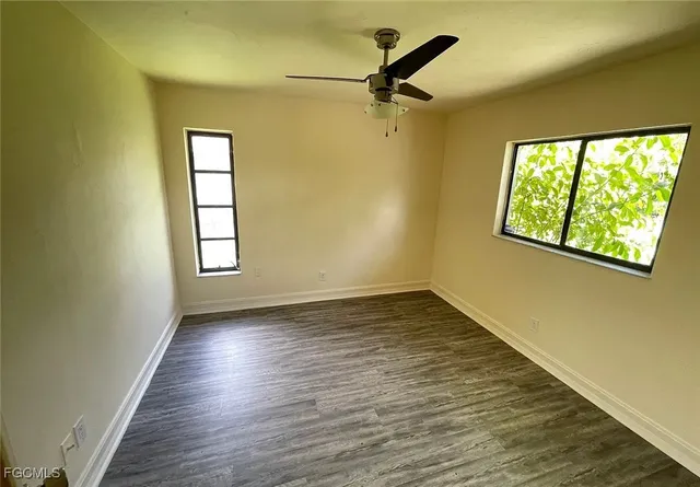 a view of an empty room and a window