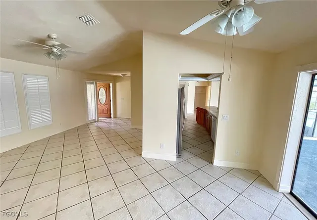 a bathroom with a granite countertop sink toilet and mirror