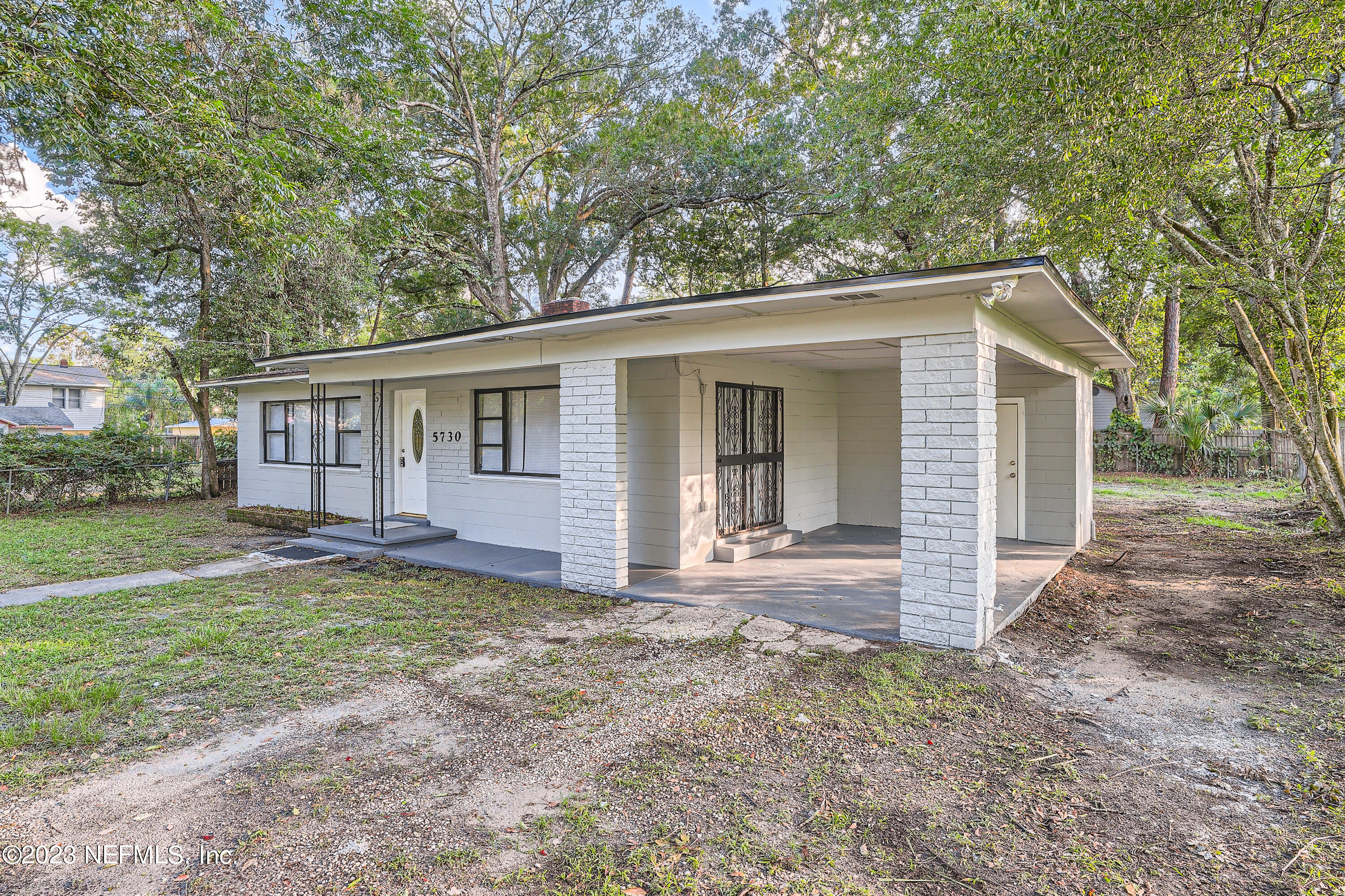 5730 Moncrief Road Jacksonville, FL 32209 - Photo 3 of 37 front view of a house with a yard