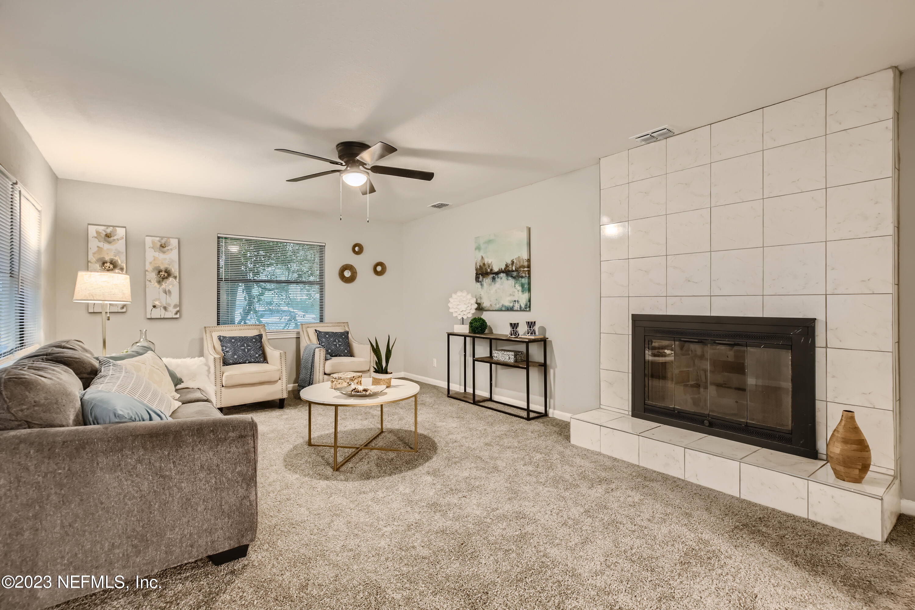 5730 Moncrief Road Jacksonville, FL 32209 - Photo 4 of 37 a living room with furniture and a fireplace