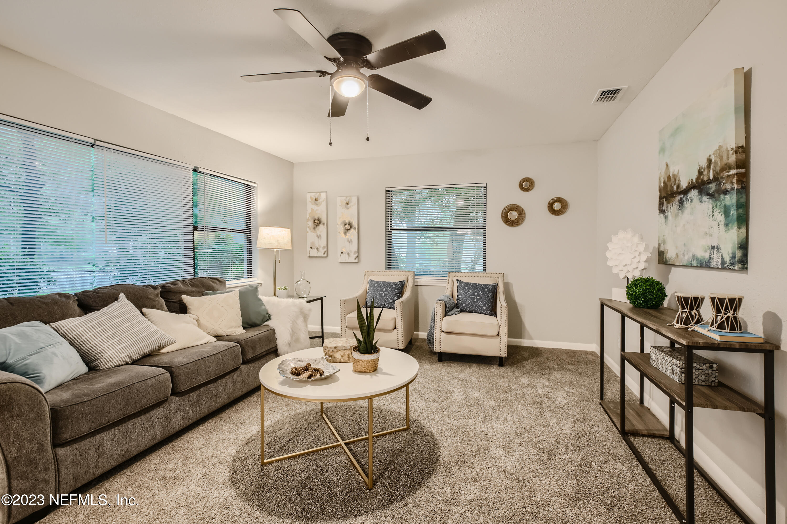 5730 Moncrief Road Jacksonville, FL 32209 - Photo 5 of 37 a living room with furniture and a large window