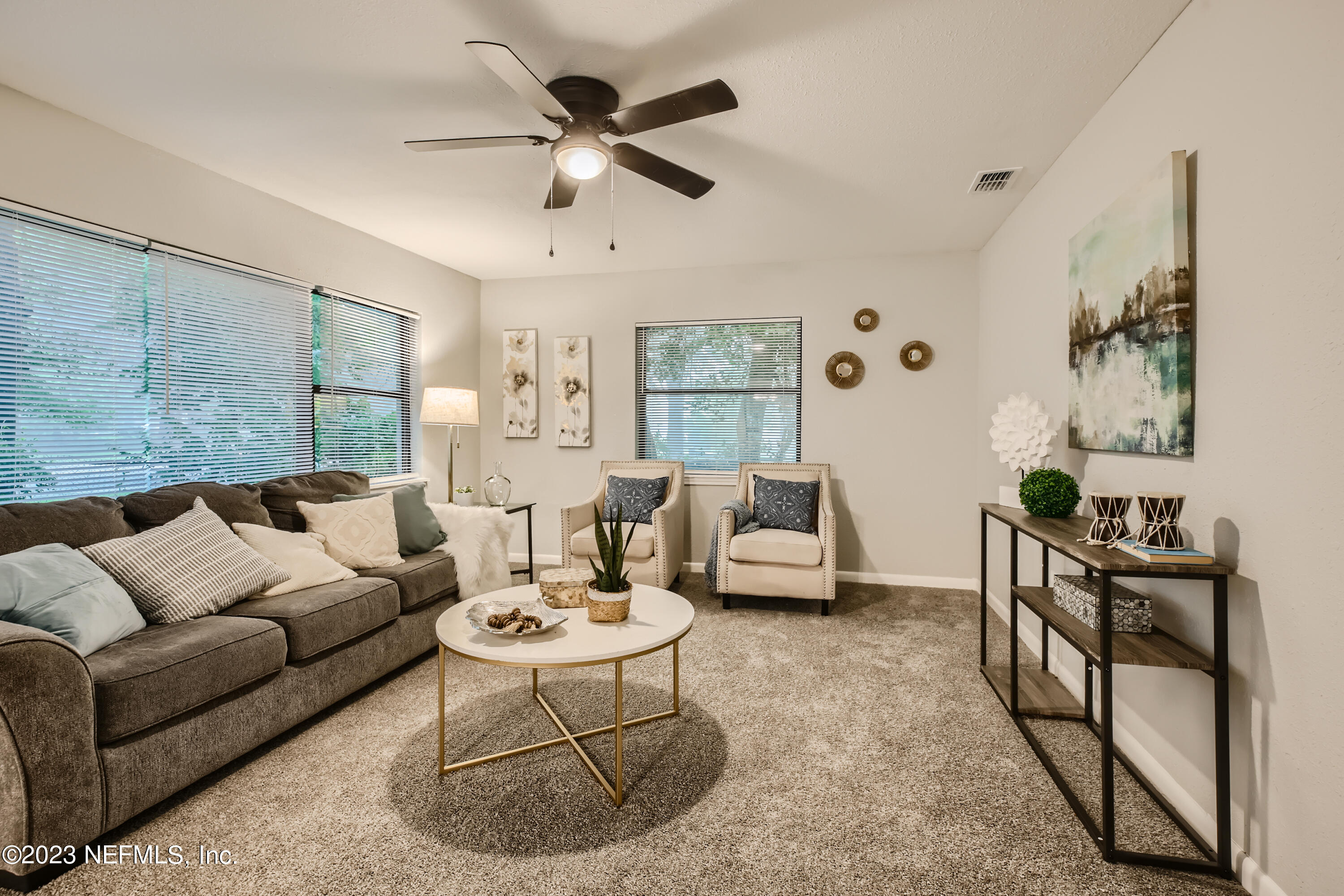 5730 Moncrief Road Jacksonville, FL 32209 - Photo 6 of 37 a living room with furniture and a large window