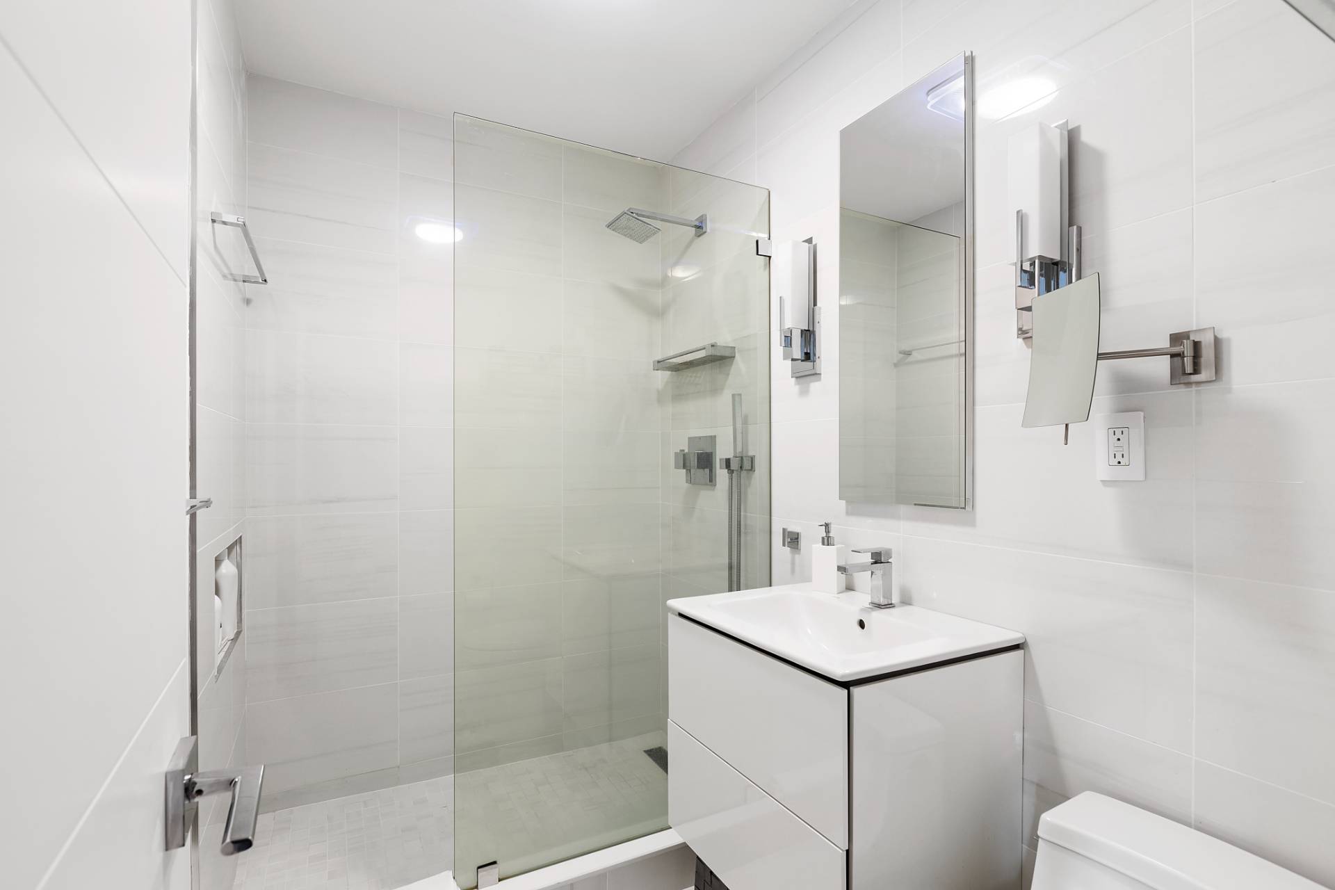 514 Pantigo Road, Unit 7 East Hampton, NY 11937 - Photo 11 of 14 a bathroom with a sink toilet a mirror and shower