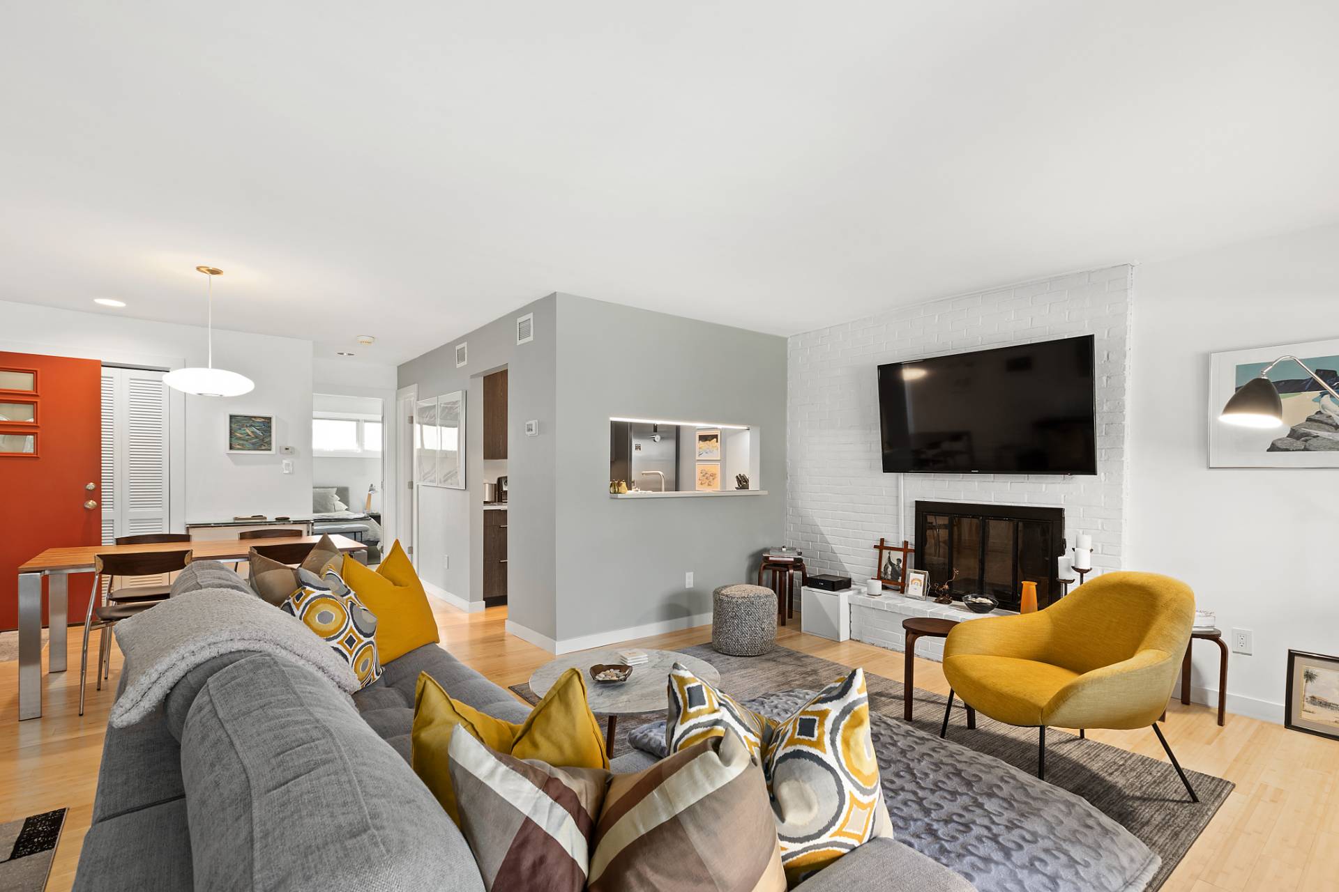 514 Pantigo Road, Unit 7 East Hampton, NY 11937 - Photo 4 of 14 a living room with furniture and a flat screen tv