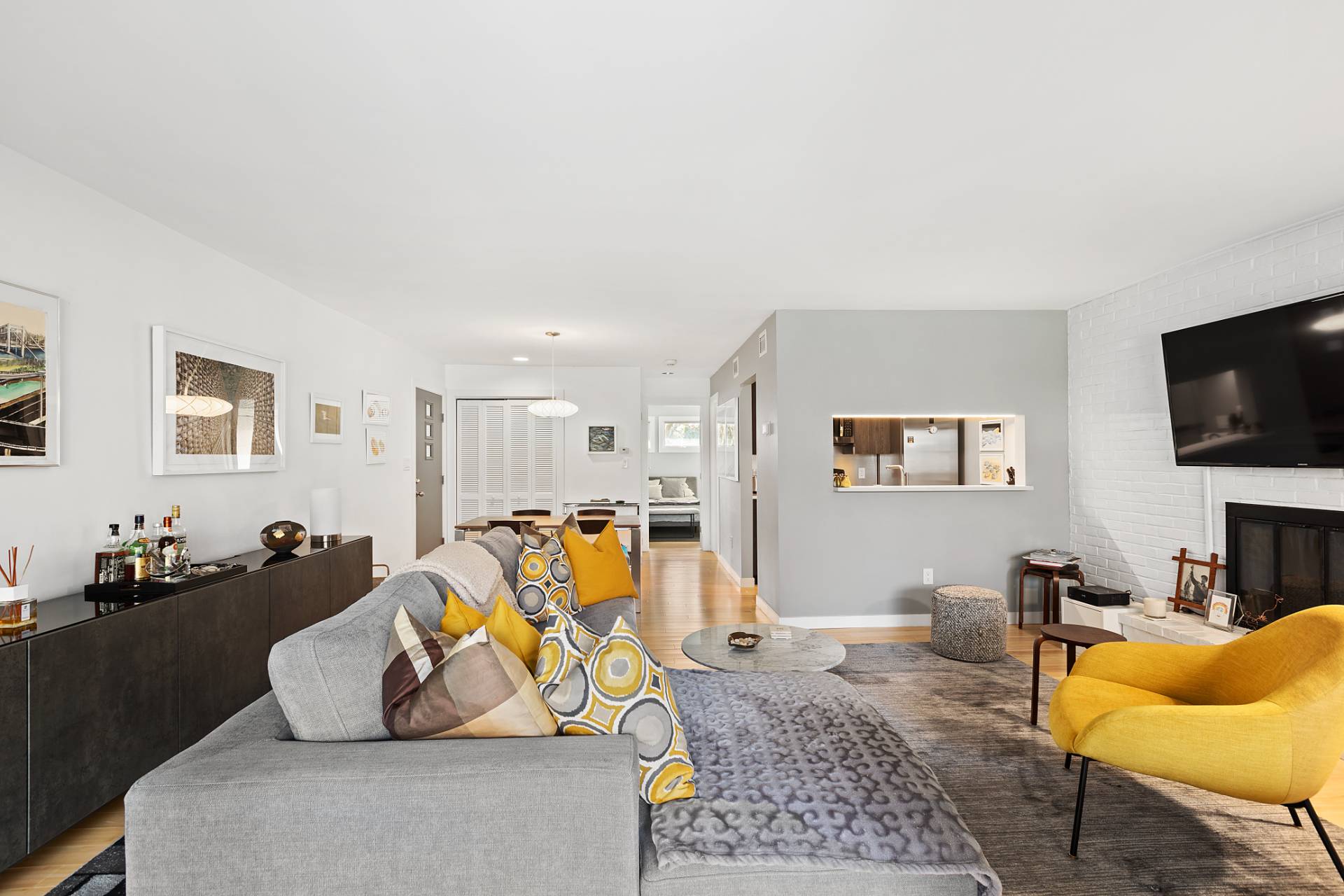 514 Pantigo Road, Unit 7 East Hampton, NY 11937 - Photo 5 of 14 a living room with furniture and a flat screen tv
