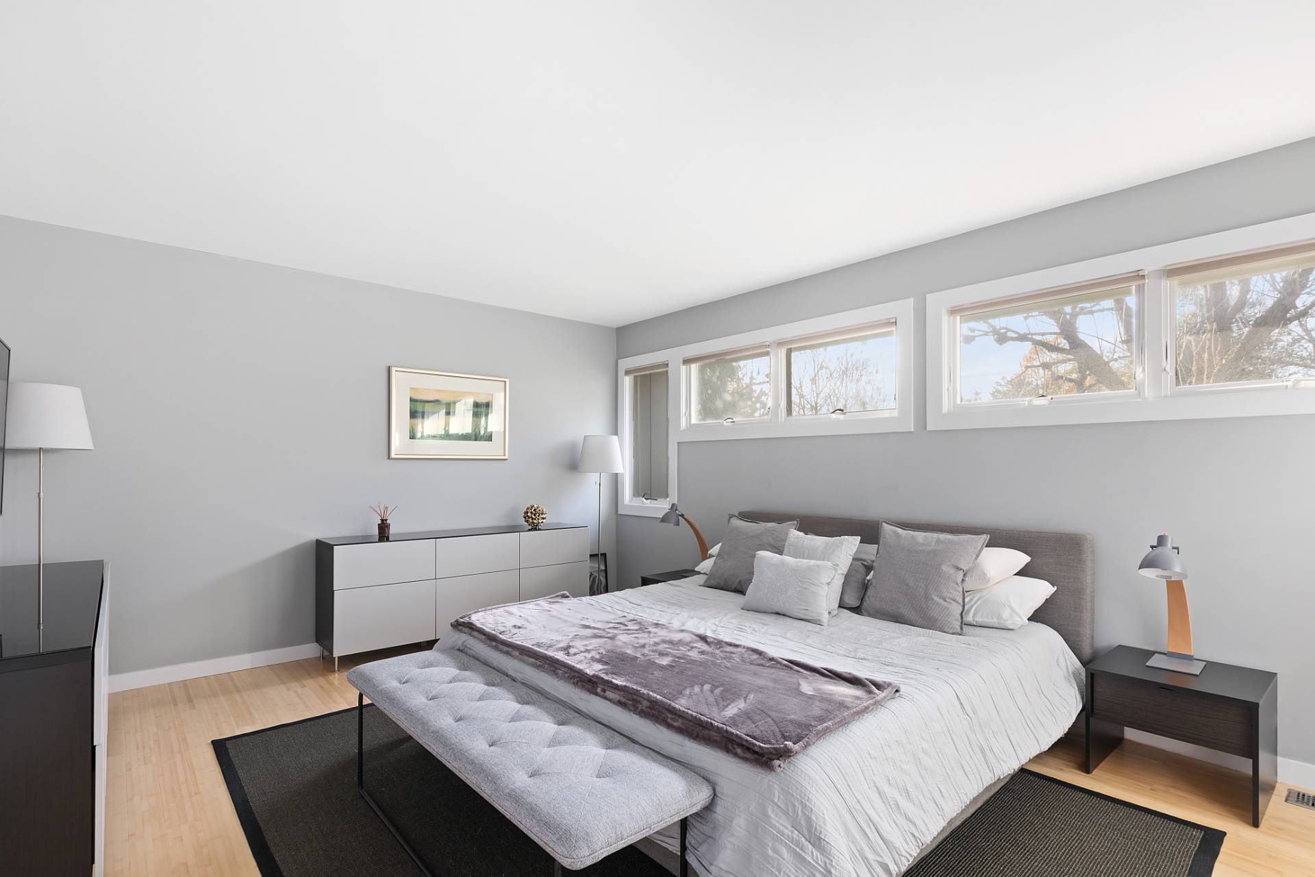 514 Pantigo Road, Unit 7 East Hampton, NY 11937 - Photo 10 of 14 a bedroom with a bed and wooden floor
