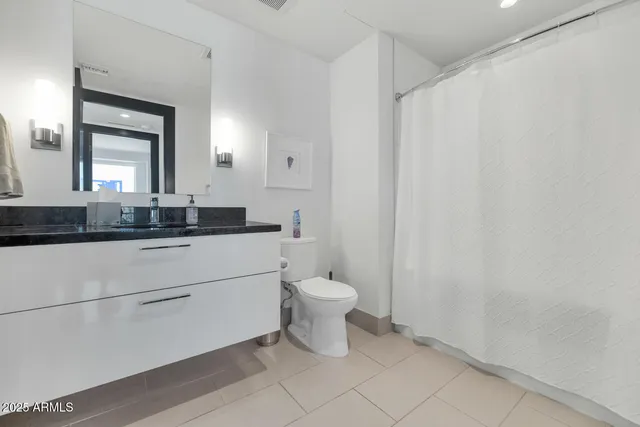 a view of a kitchen with a sink and cabinets