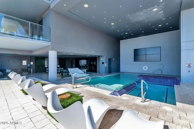 a living room with couch and a large window