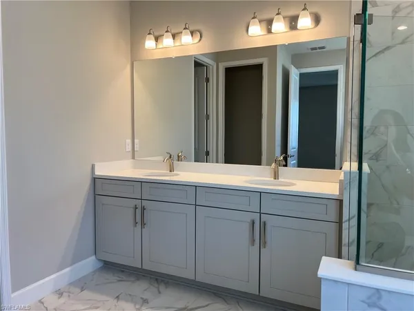 a bathroom with a bathtub and a sink