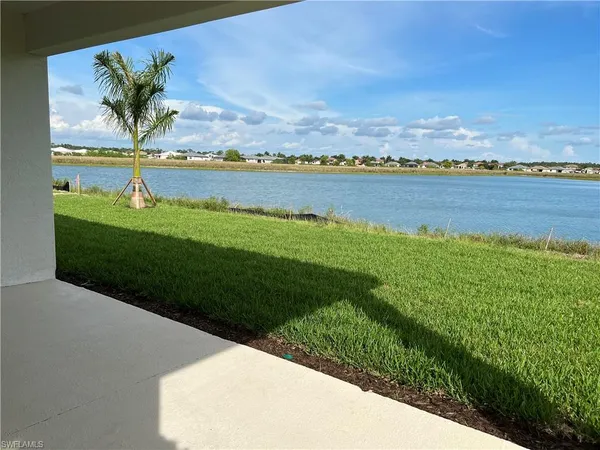 a view of a lake with houses in the back