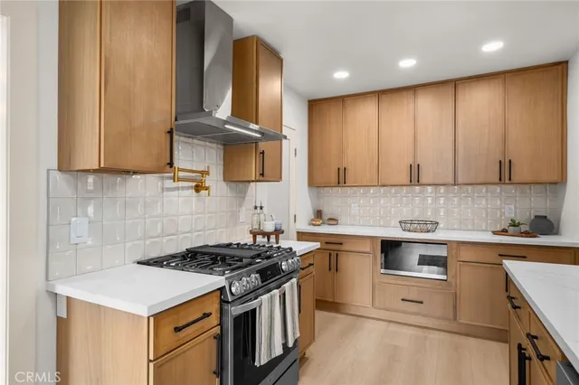 a kitchen with a stove and a sink