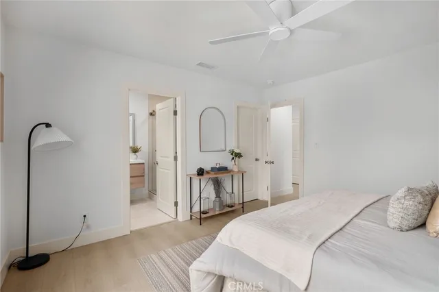 a spacious bedroom with a bed and a table