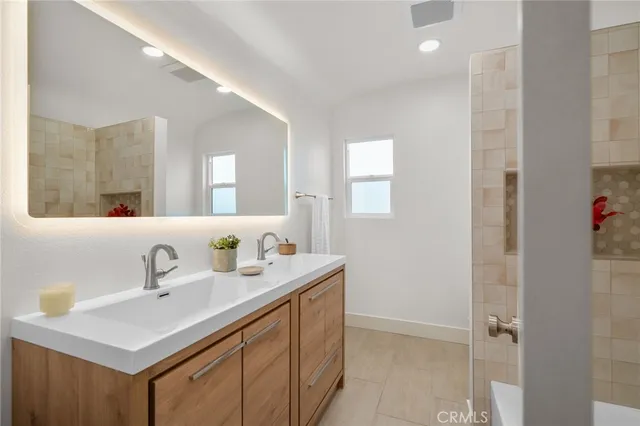 a bathroom with a bathtub and shower