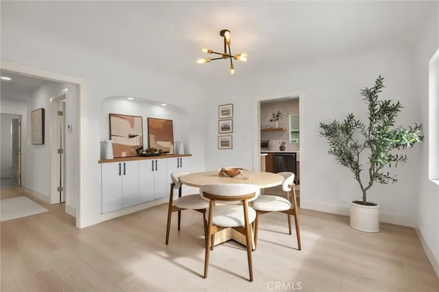 a view of a livingroom with furniture and a potted plant
