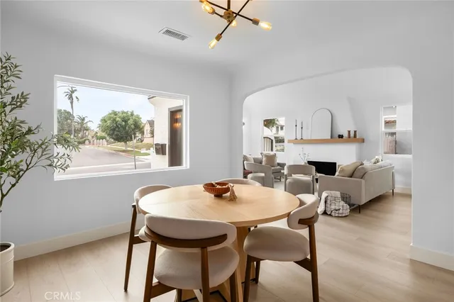 a view of a dining room with furniture and a window