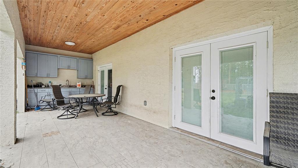 5211 Southwest 103rd Loop Ocala, FL 34476 - Photo 12 of 18 a work room with table and chairs