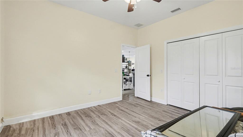 5211 Southwest 103rd Loop Ocala, FL 34476 - Photo 10 of 18 wooden floor in an empty room