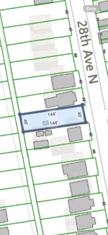 a view of staircase with white walls and a black gate