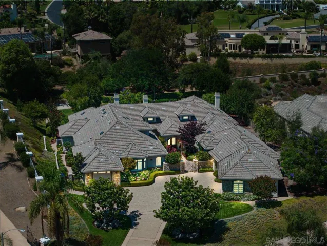 an aerial view of multiple houses with yard