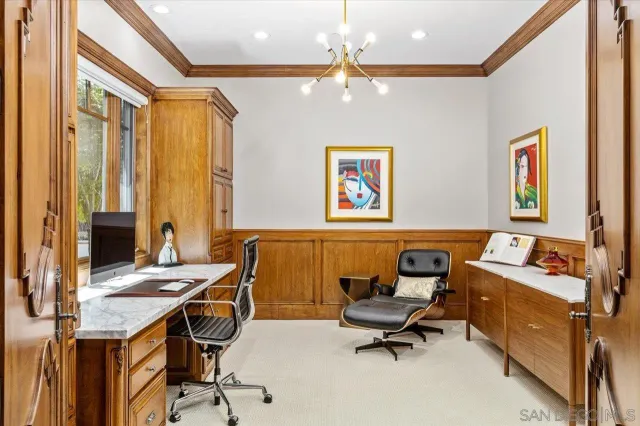 a workspace with furniture and window