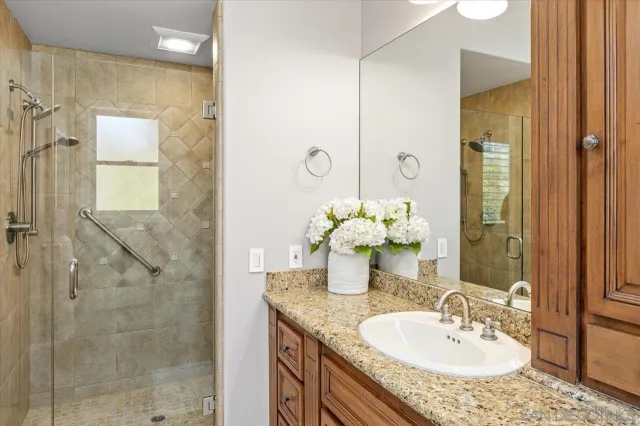 a bedroom with a bed and a mirror