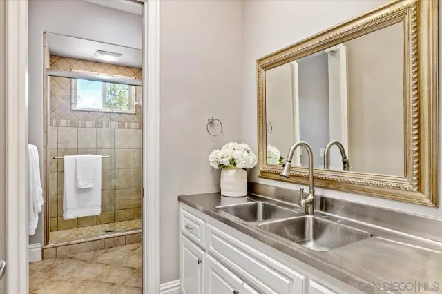 an aerial view of a houses with a yard and outdoor seating