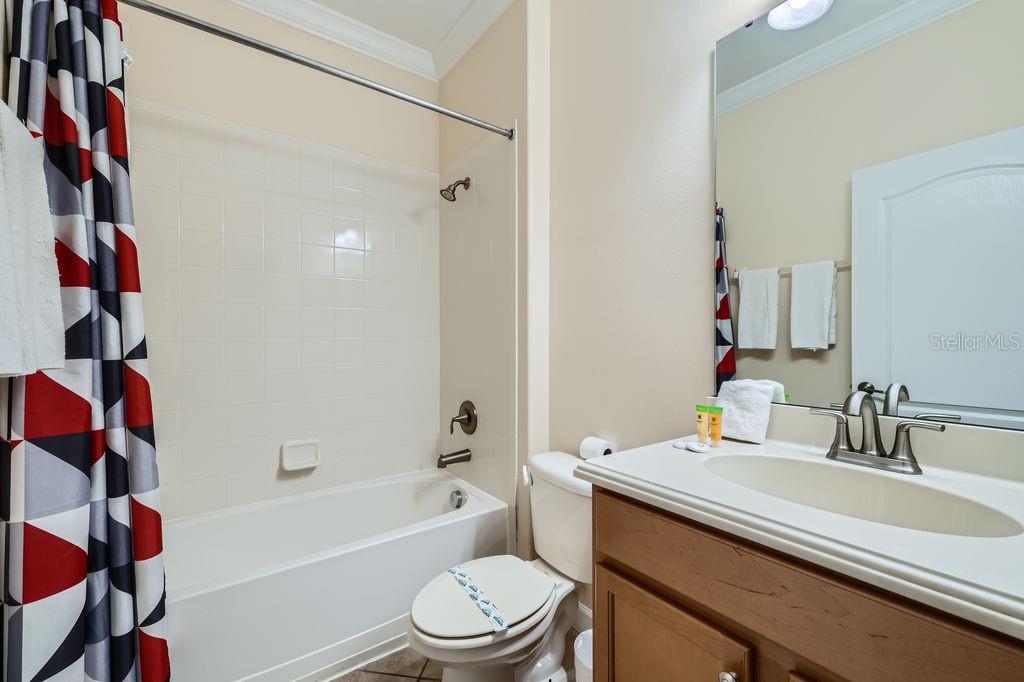 2999 Buccaneer Palm Road Kissimmee, FL 34747 - Photo 23 of 49 a bathroom with a sink a toilet and shower
