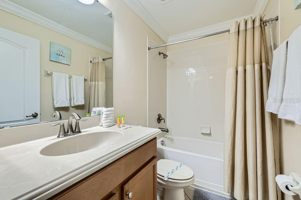 2999 Buccaneer Palm Road Kissimmee, FL 34747 - Photo 26 of 49 a bathroom with a sink toilet tub and shower