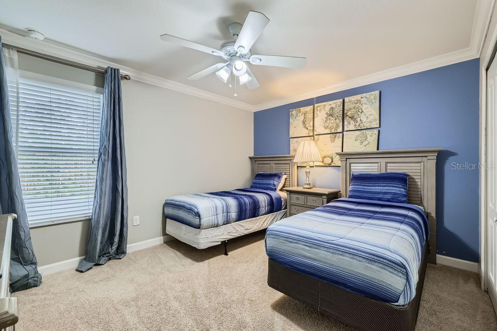 2999 Buccaneer Palm Road Kissimmee, FL 34747 - Photo 27 of 49 a bedroom with two beds and a window