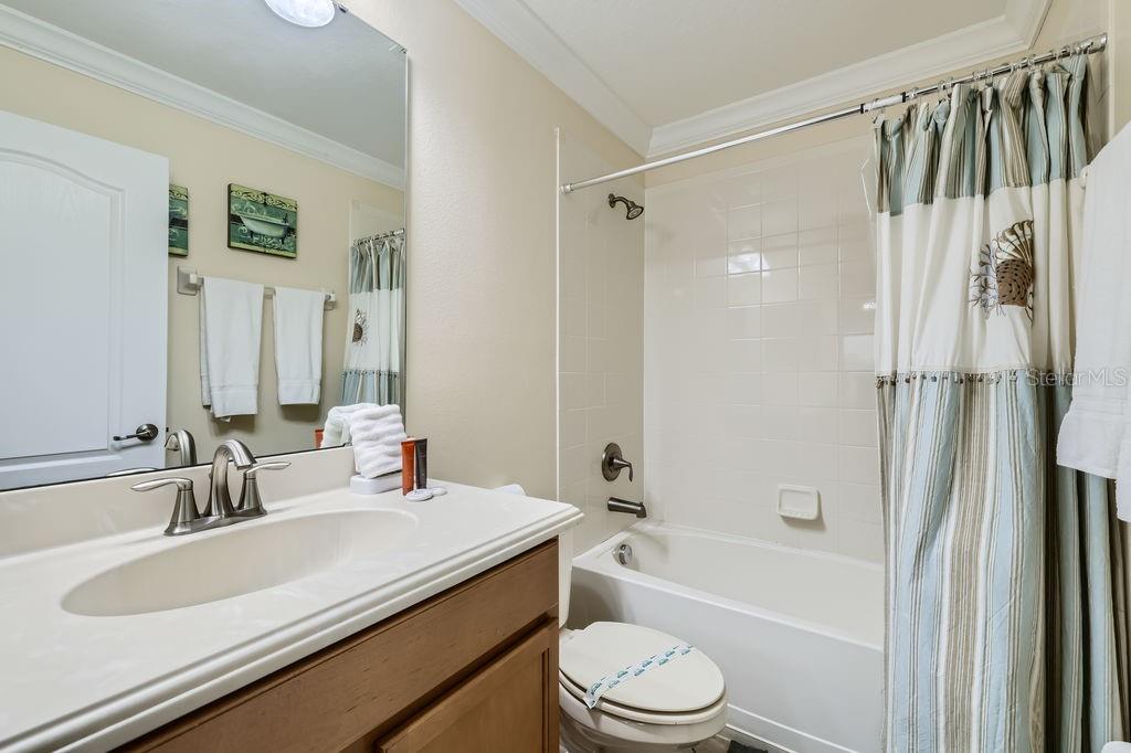 2999 Buccaneer Palm Road Kissimmee, FL 34747 - Photo 28 of 49 a bathroom with a sink a toilet and a bathtub