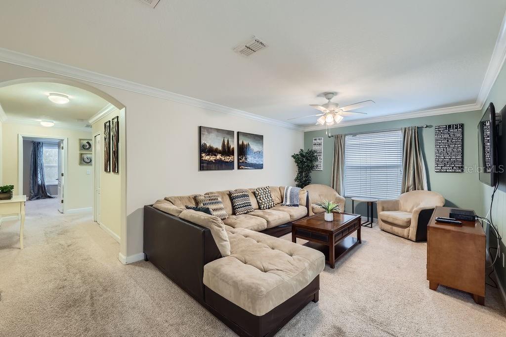 2999 Buccaneer Palm Road Kissimmee, FL 34747 - Photo 29 of 49 a living room with furniture and a large window