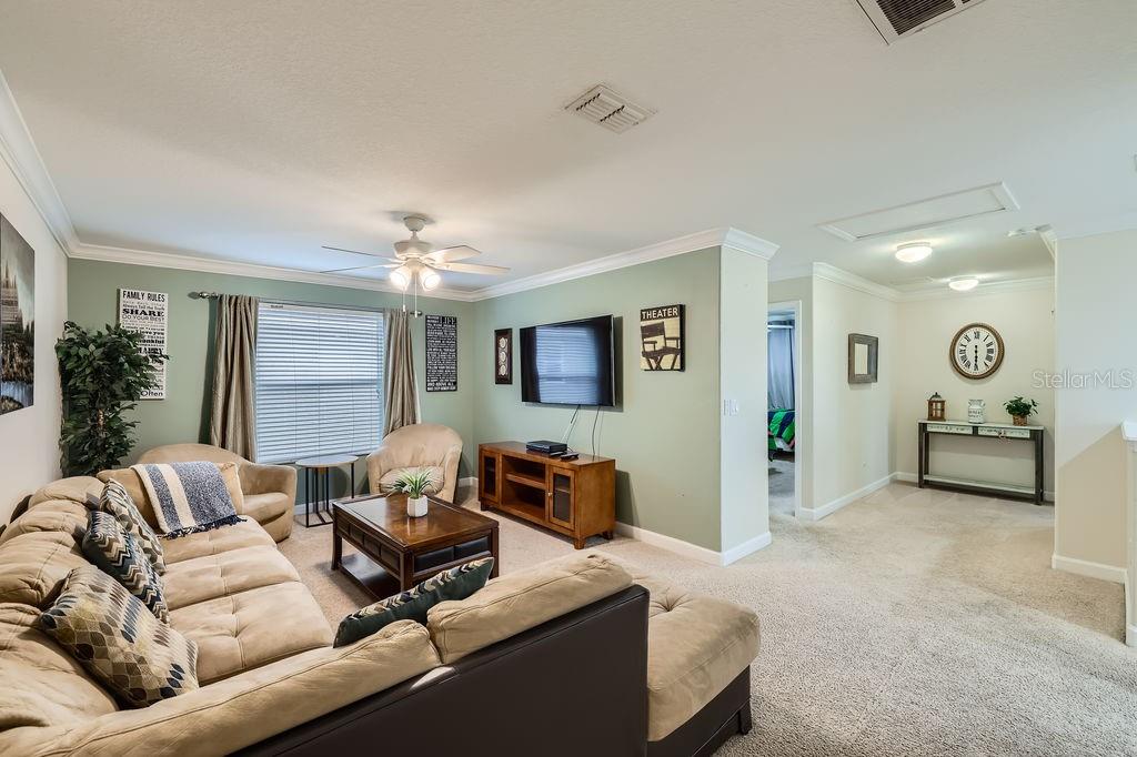 2999 Buccaneer Palm Road Kissimmee, FL 34747 - Photo 30 of 49 a living room with furniture and a large window