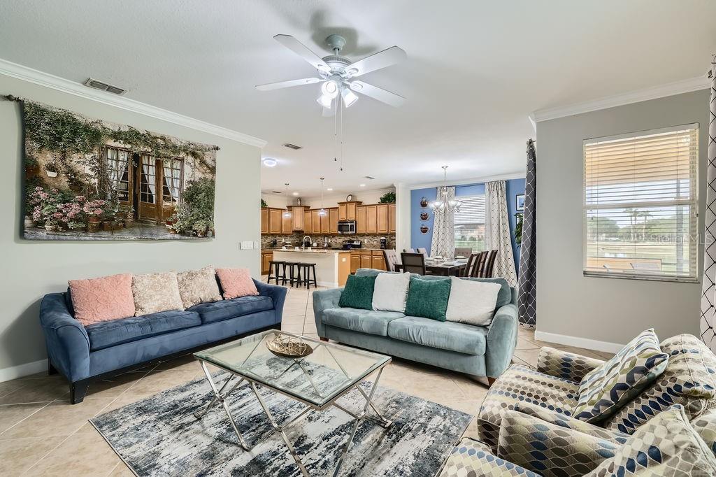 2999 Buccaneer Palm Road Kissimmee, FL 34747 - Photo 9 of 49 a living room with furniture and a large window