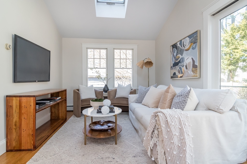 11 Durant Road Wellesley, MA 02482 - Photo 13 of 28 a living room with furniture a flat screen tv and a window