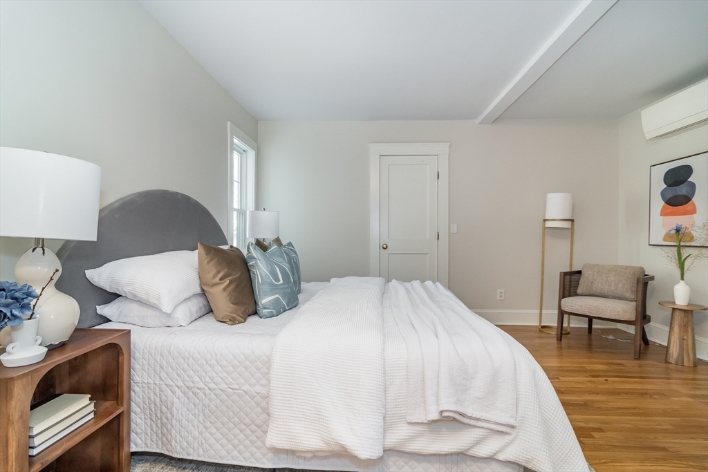 11 Durant Road Wellesley, MA 02482 - Photo 15 of 28 a bedroom with a bed and chair