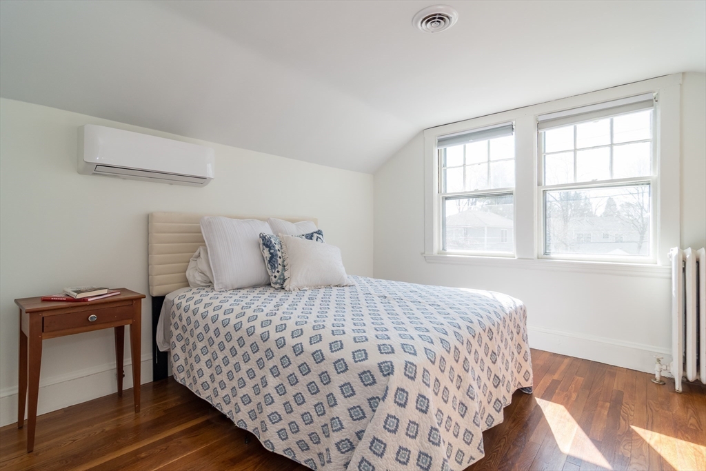 11 Durant Road Wellesley, MA 02482 - Photo 17 of 28 a bedroom with a bed and wooden floor