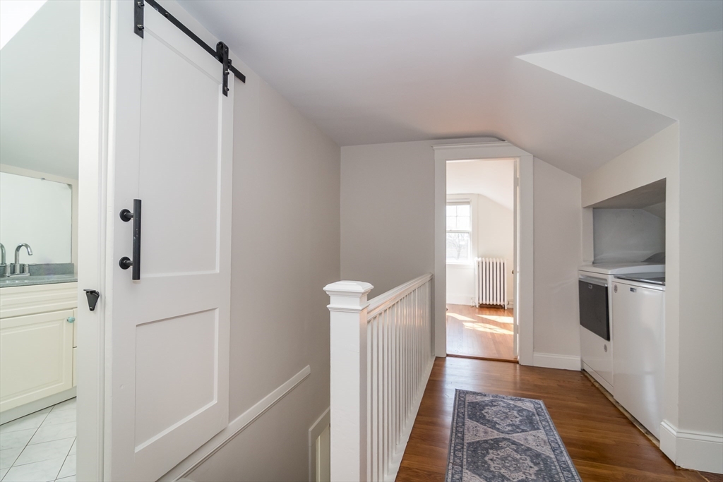 11 Durant Road Wellesley, MA 02482 - Photo 18 of 28 a kitchen with white cabinets and white appliances