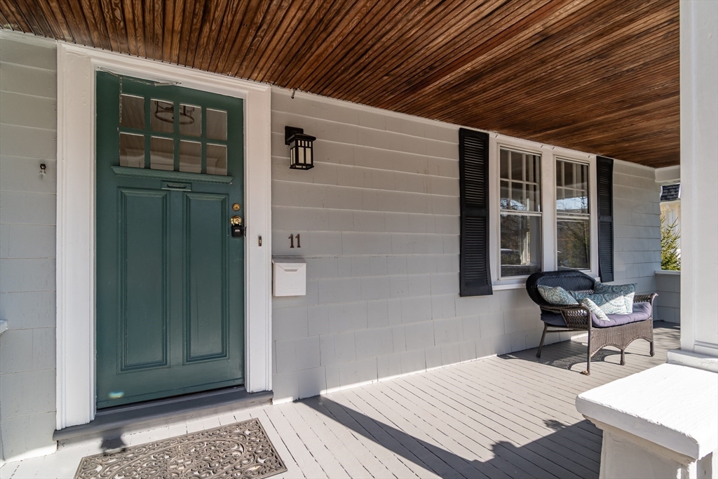 11 Durant Road Wellesley, MA 02482 - Photo 2 of 28 a balcony with table and chairs