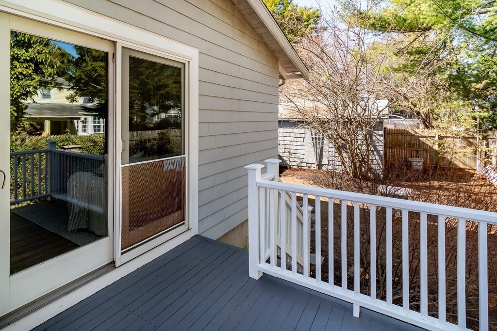 11 Durant Road Wellesley, MA 02482 - Photo 26 of 28 a view of a porch with wooden floor and iron fence
